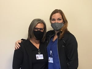 Dr. Janz from Moreland OBGYN with nurse Signe with COVID protective masks on