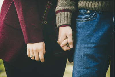 Couple holding hands
