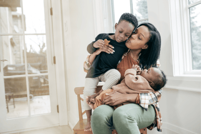 Mom Finding Time with Older Sibling While Carrying for Newborn