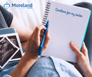 Pregnant Patient Writing List of Questions for Moreland provider