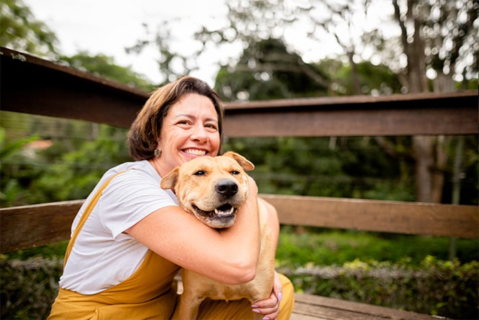 happy older woman with her dog